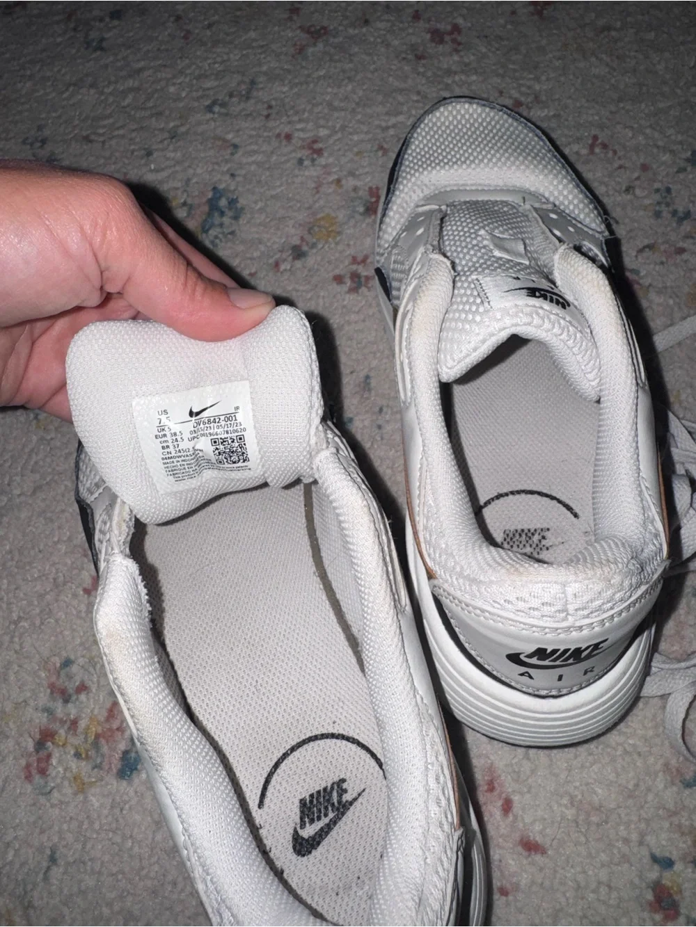 Nike White Sneakers with Black Trim and Gold Swoosh